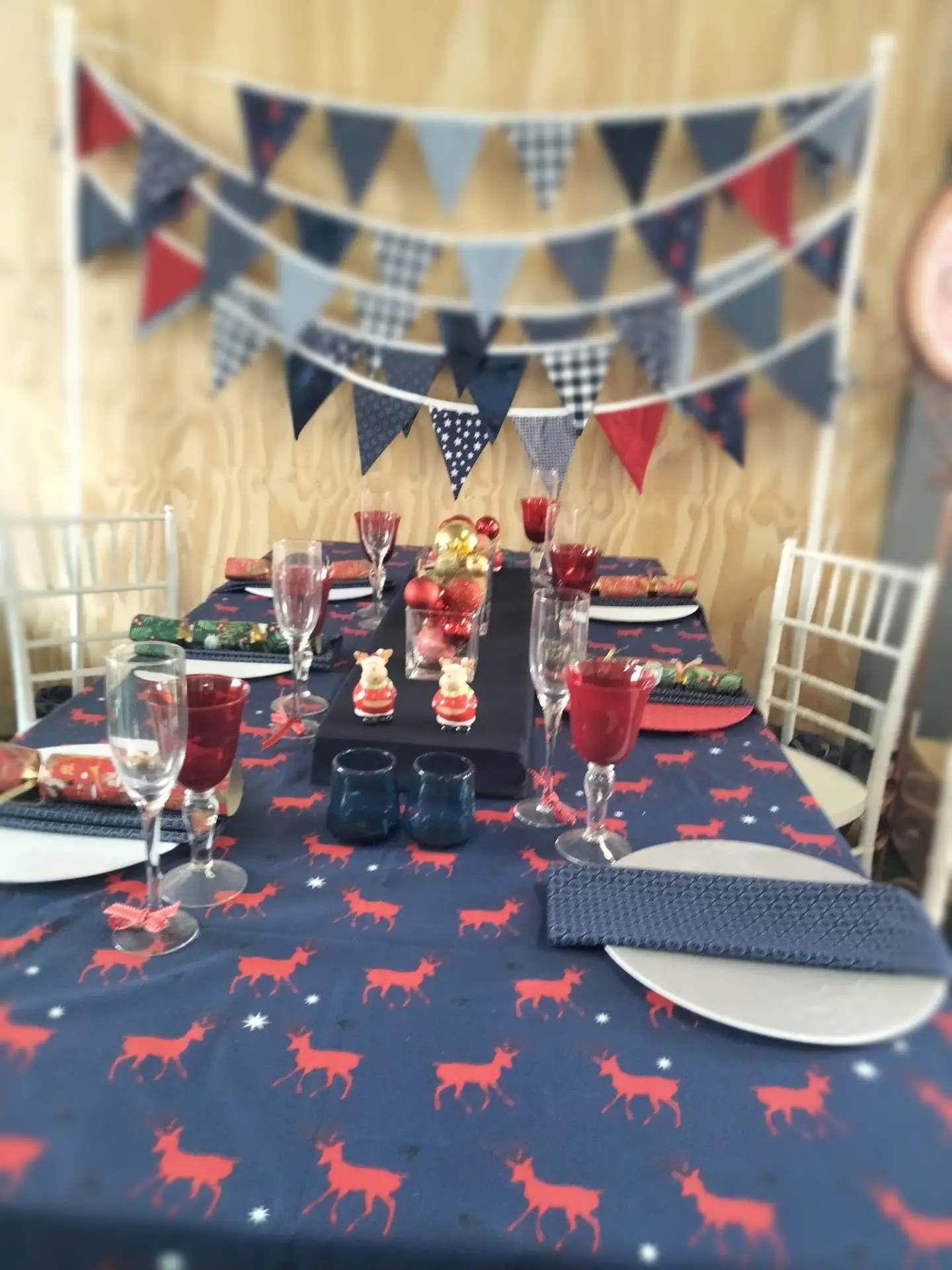 Colorful festive table with decorations and dinnerware.