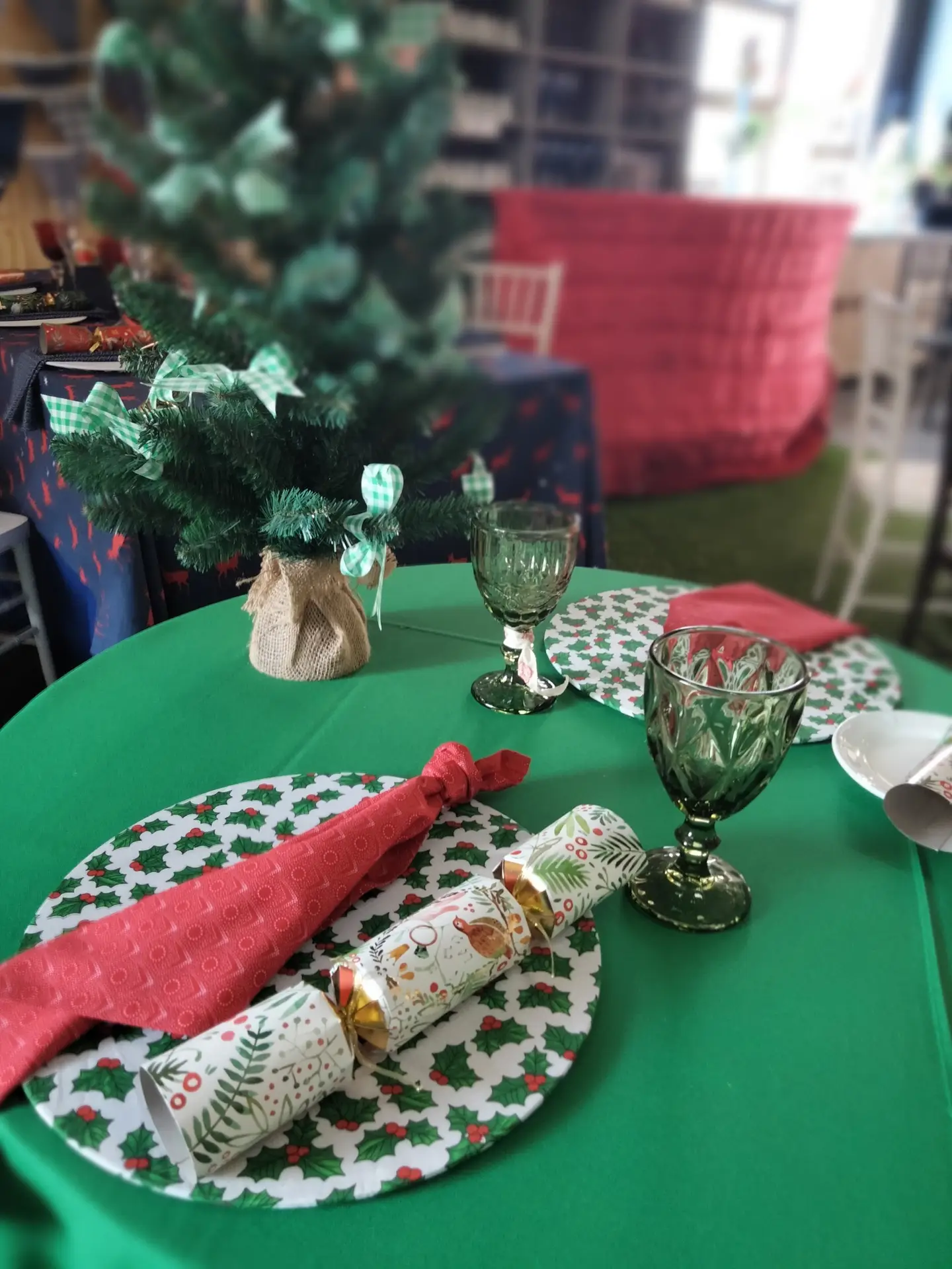 Colorful festive table with plates, napkins, and holiday crackers