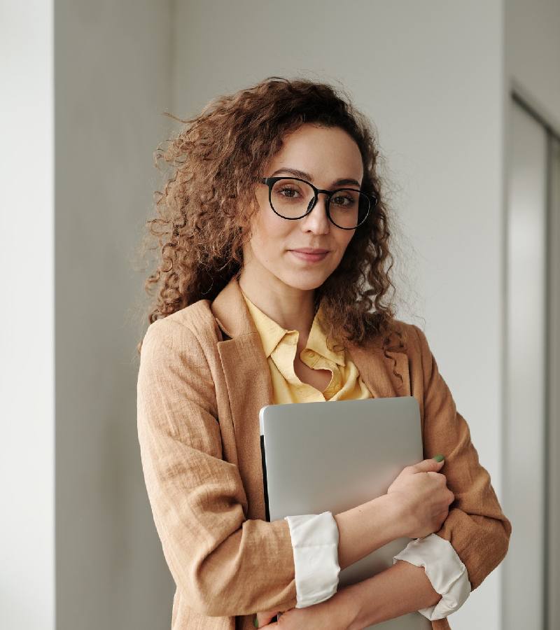 Professional team member holding a laptop