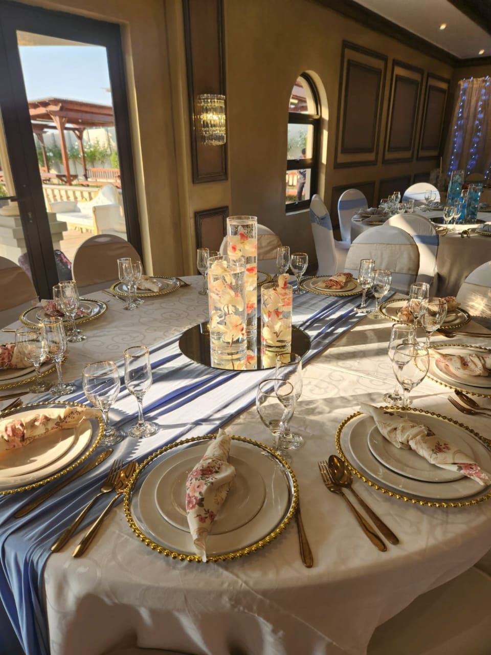 Elegant table setting with floral napkins and candles