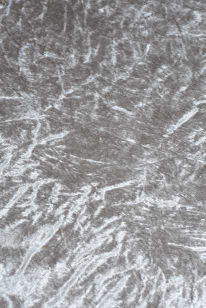Close-up of a textured silver charger plate.