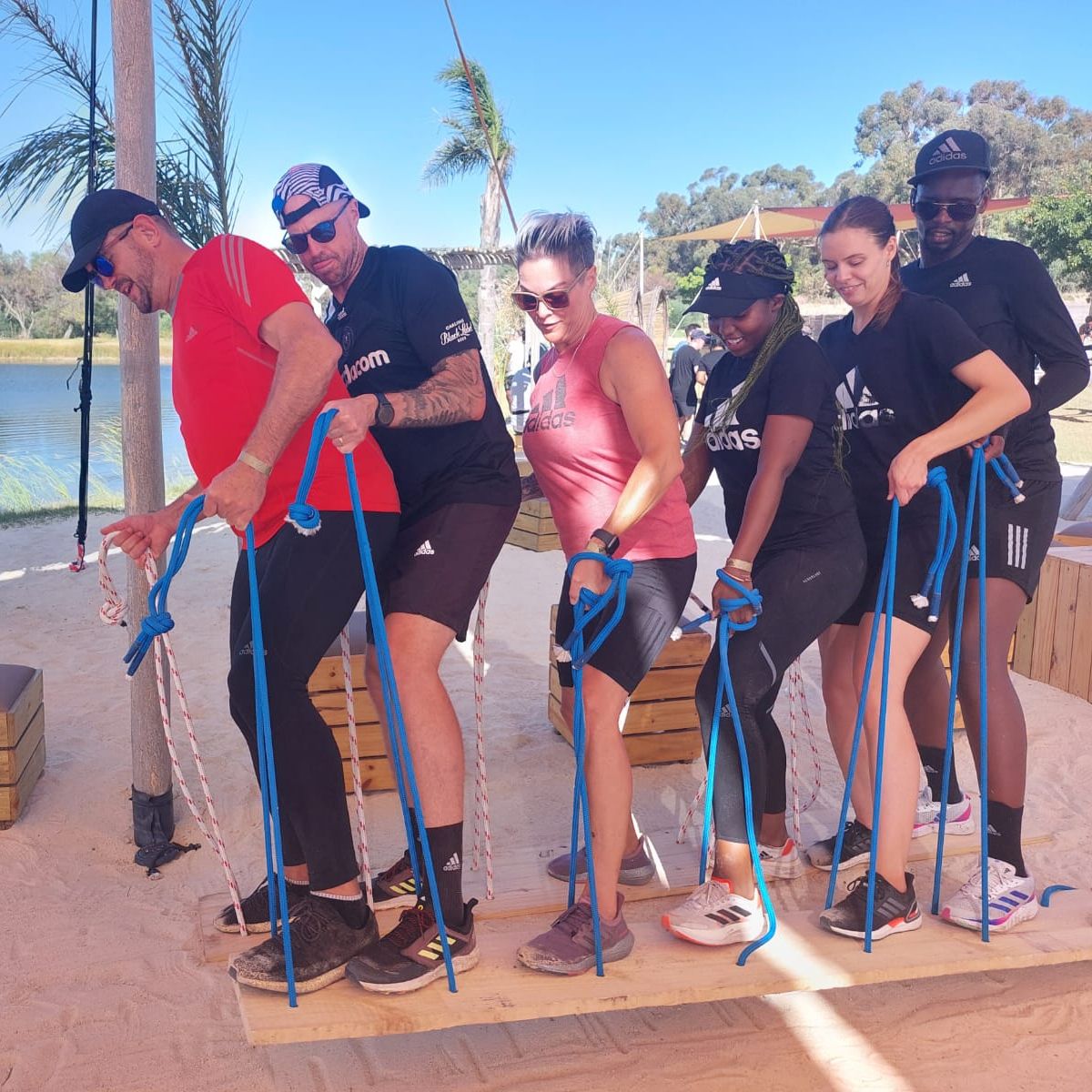 Participants engaging in a team-building challenge outdoors