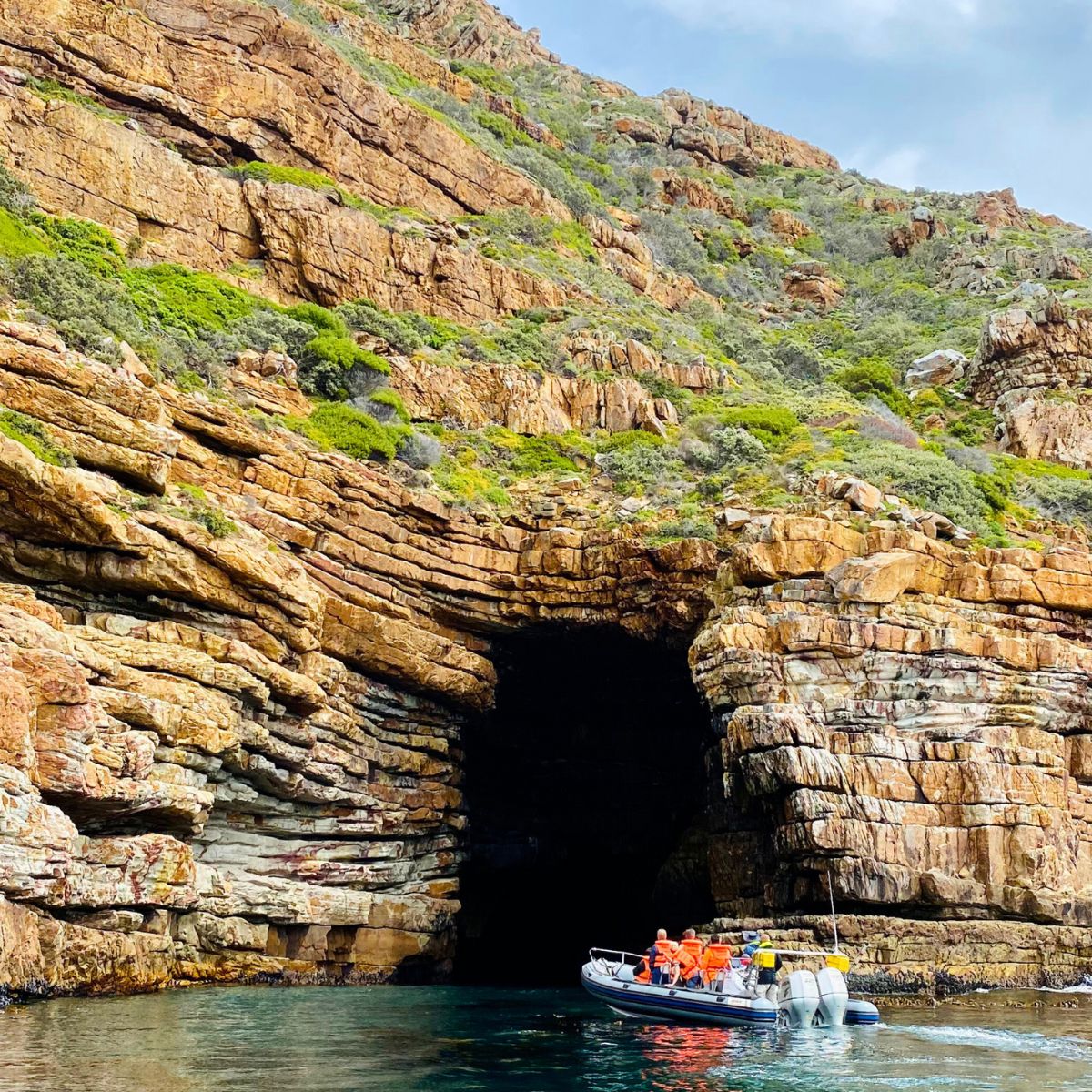 Boat trip near rocky coastal area in Hout Bay, Cape Town.
