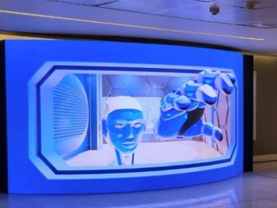 Holographic display showing a robotic hand and face.