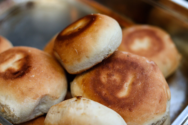 Close-up of freshly baked homemade breads on a tray