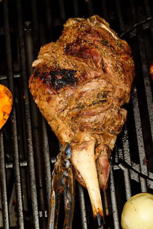 Grilled leg of lamb on a braai grill