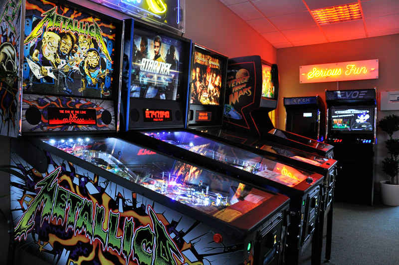 Multiple pinball machines in a gaming area