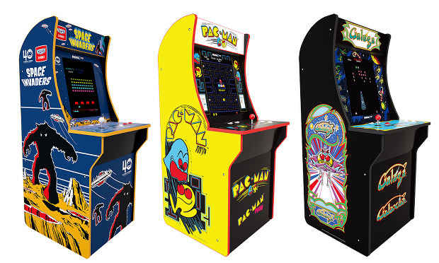 Three classic arcade game machines lined up