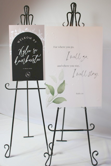 Two decorative welcome signs on easels