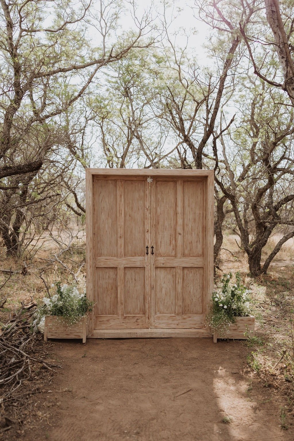 Rustic wooden door backdrop with flowers in a natural setting