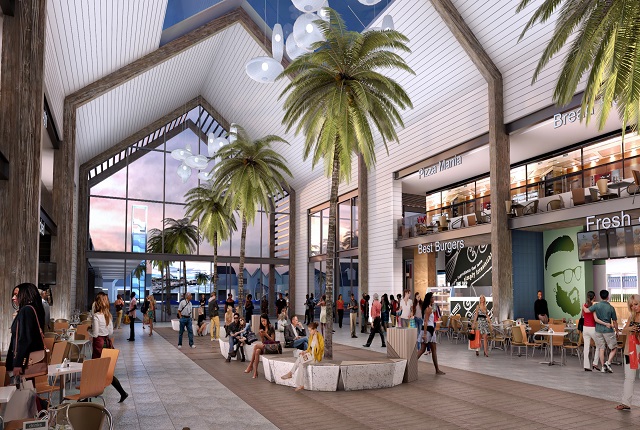 Interior of a lively food court with palm trees and contemporary decor.