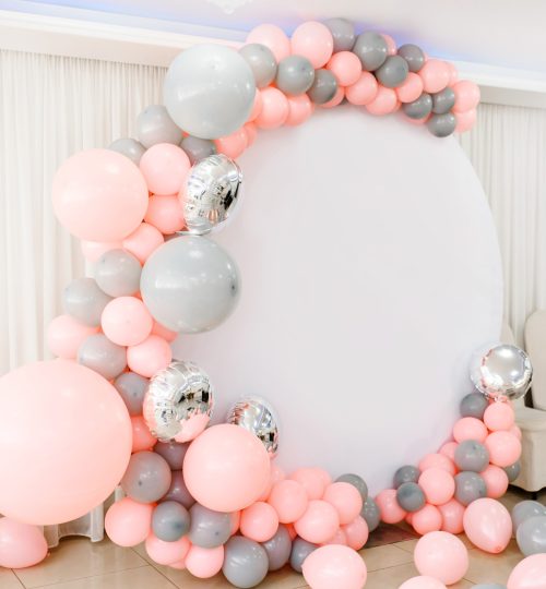 Organic balloon backdrop with pink and grey balloons