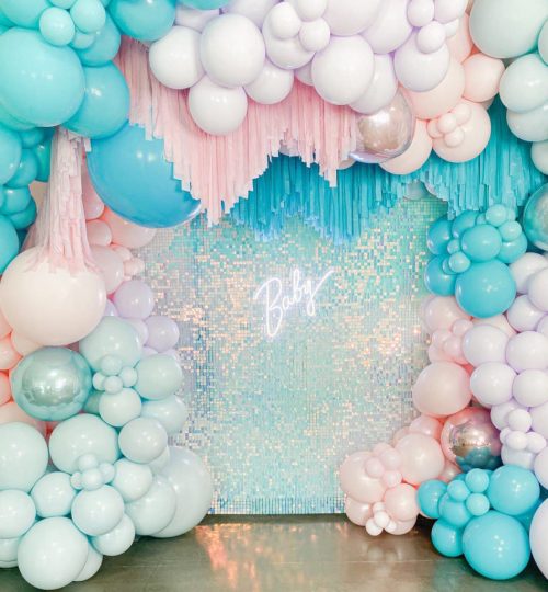 Colorful balloon backdrop for baby shower celebration.