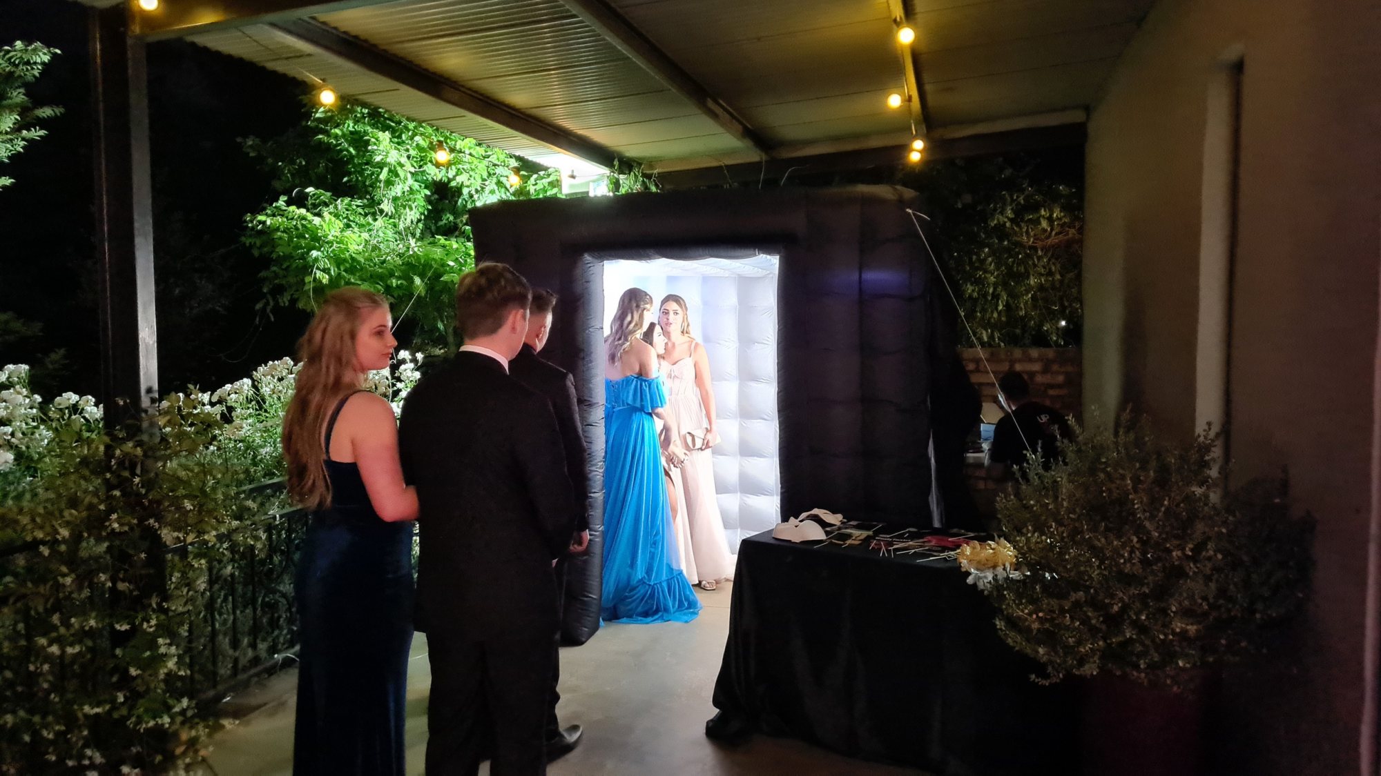 Guests near an inflatable photo booth at an event