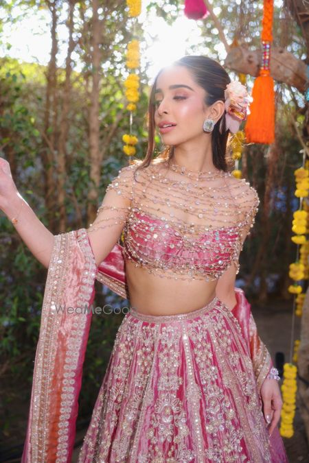 Bridal model in pink lehenga with intricate embellishments