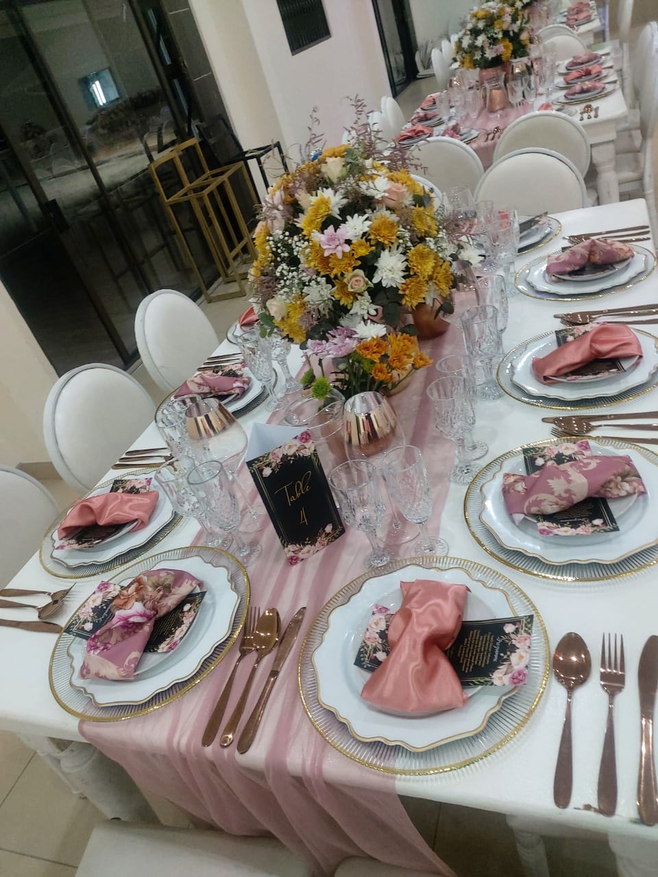 Colorful floral centerpiece on a decorated dining table