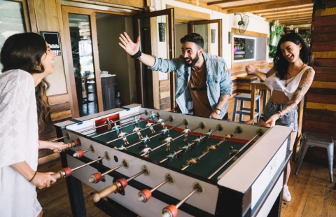 Group playing foosball at an event