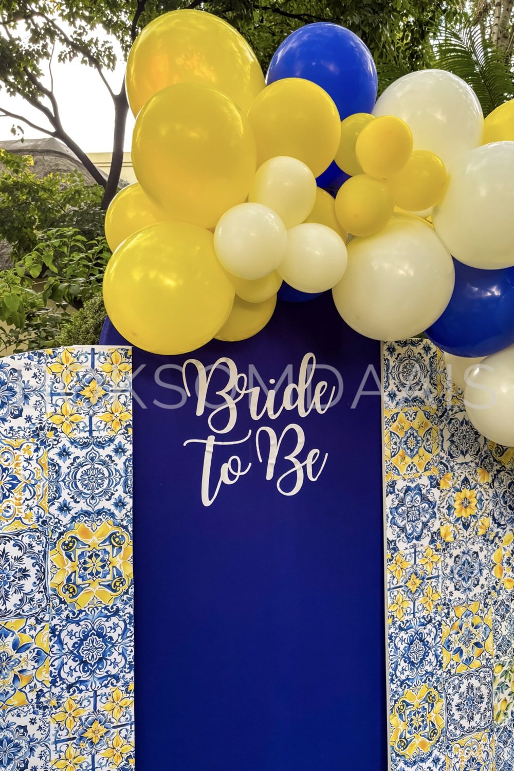 Backdrop featuring 'Bride To Be' with balloons and decorative patterns