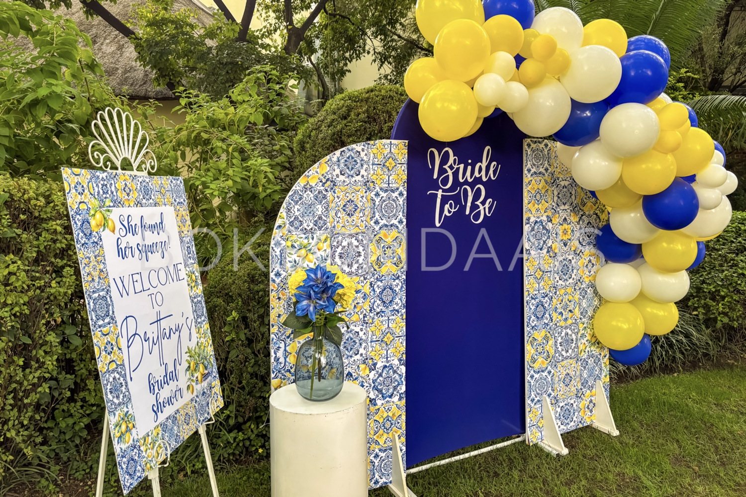 Bridal shower entrance with decorative signage and balloons