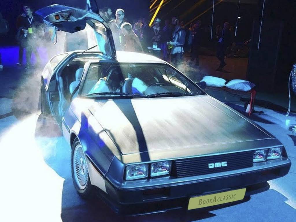 DMC DeLorean car with open doors at an event