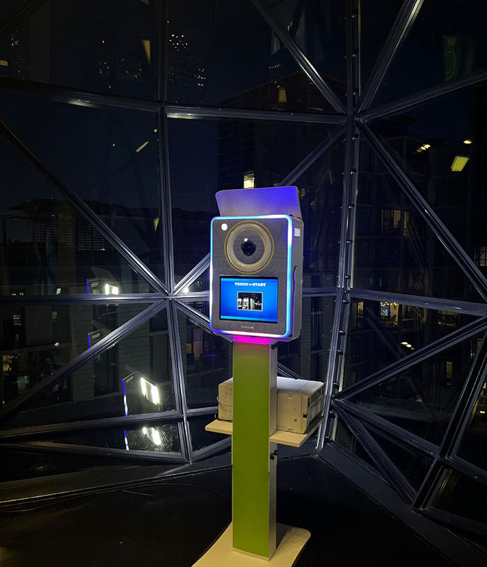 Illuminated 360 photo booth in a modern venue