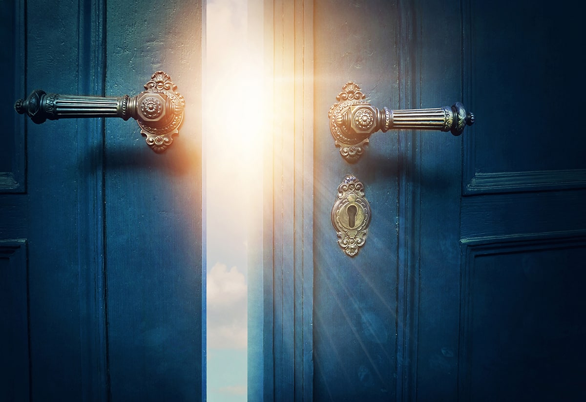 Open door revealing light, symbolizing entry to adventure.