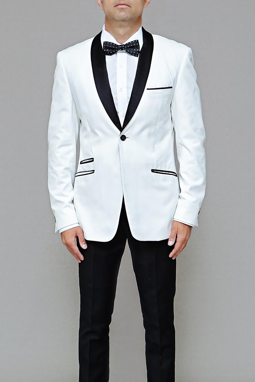 White tuxedo with black lapels and a black bow tie