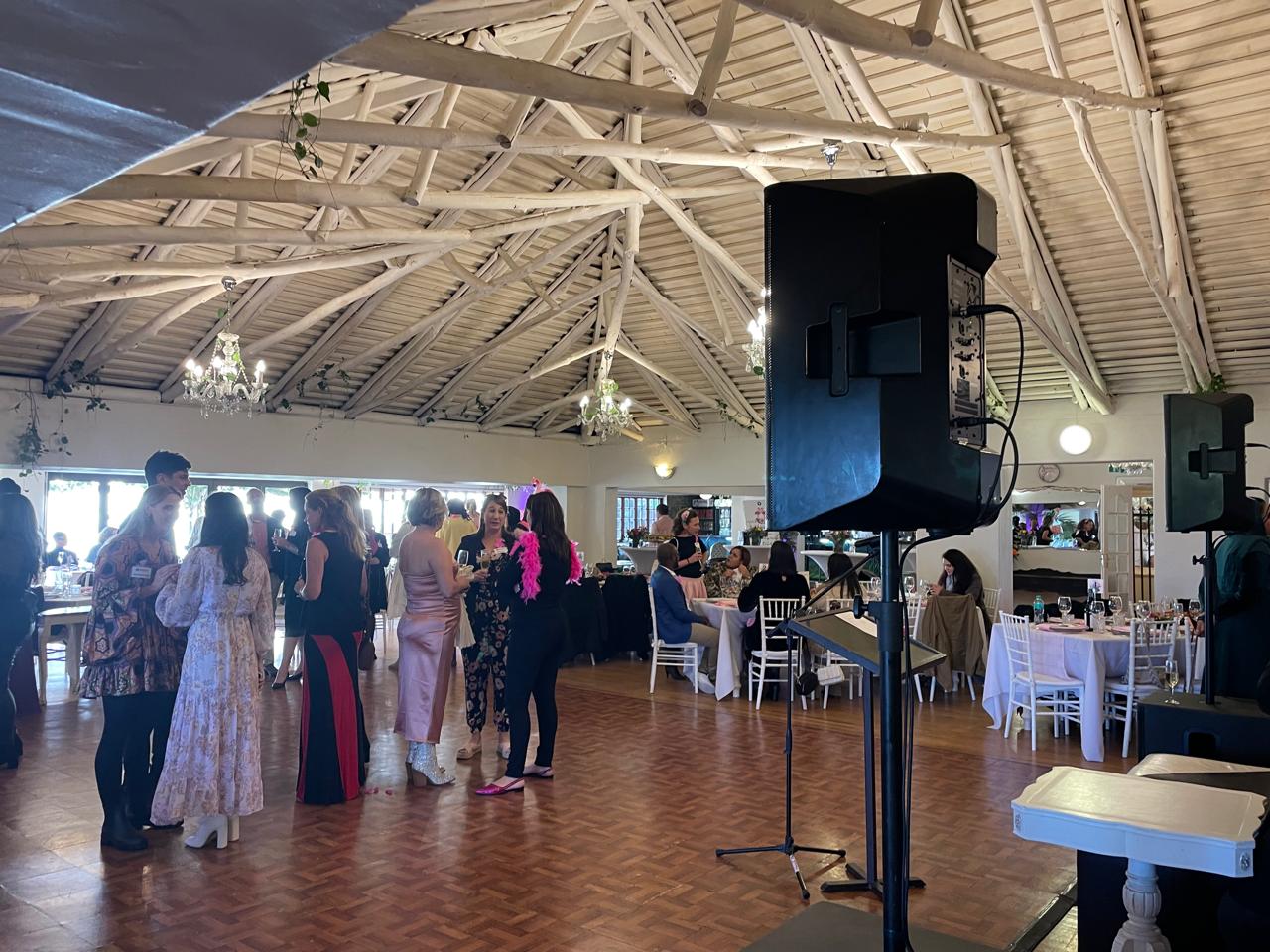 Lighting equipment set up in a spacious event venue.