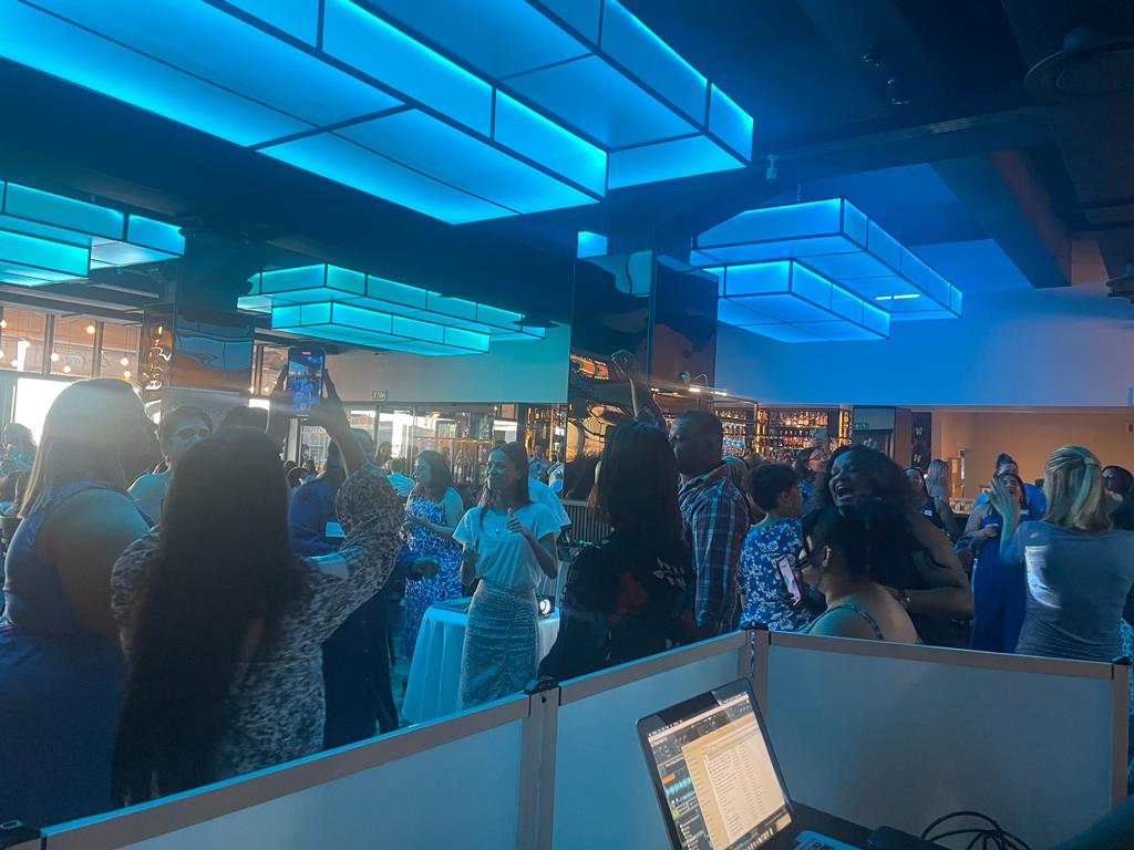 A lively gathering with uplighting at an event in Cape Town.