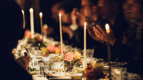Candlelit table setting with taper candles