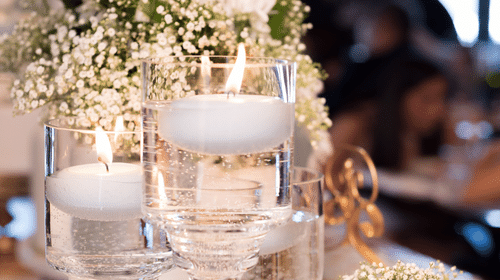 Three floating candles in clear glass holders