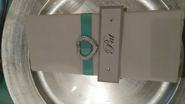 Personalized napkin with name tag and decorative band