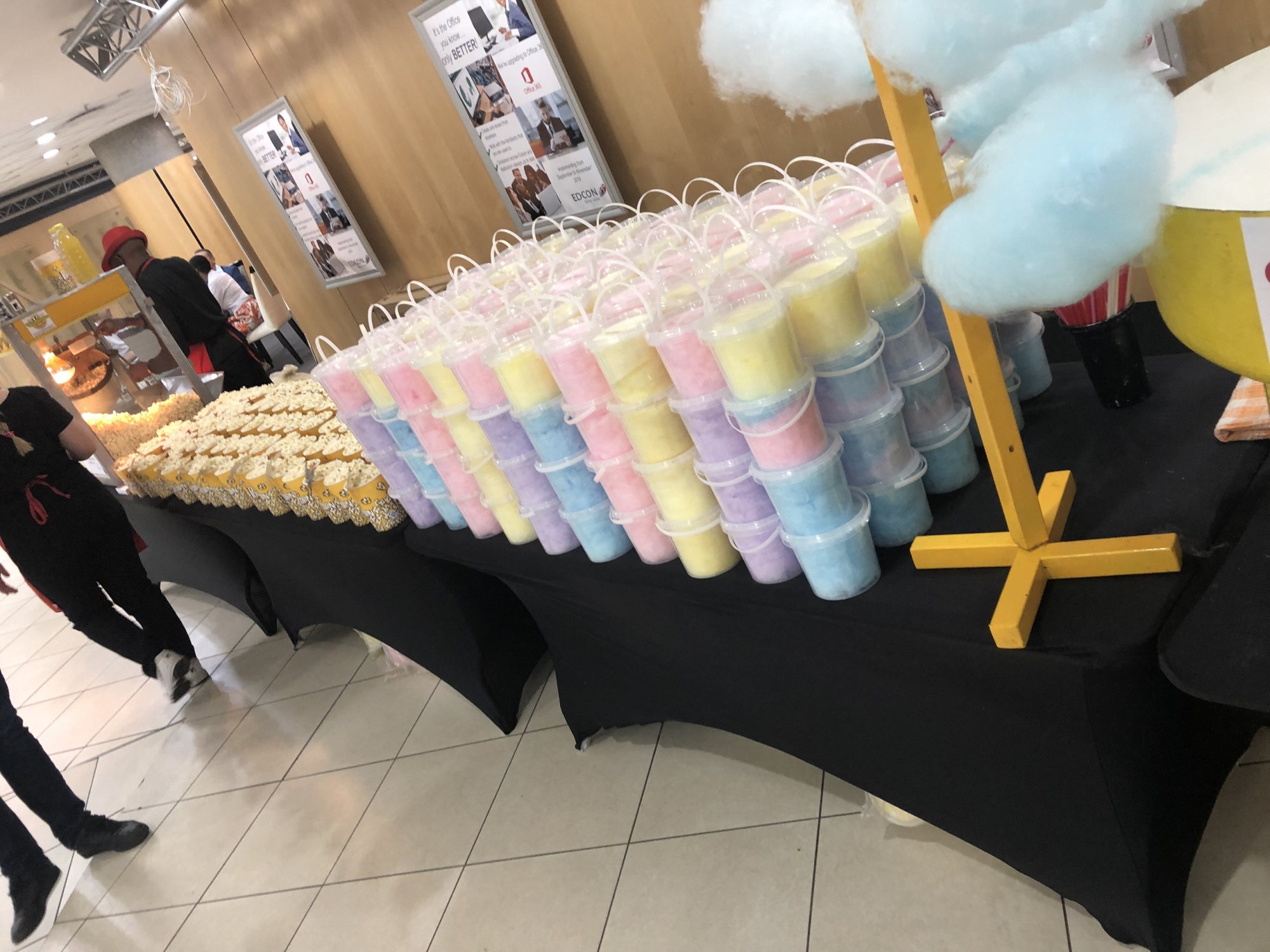 Stacks of colourful cotton candy in clear cups