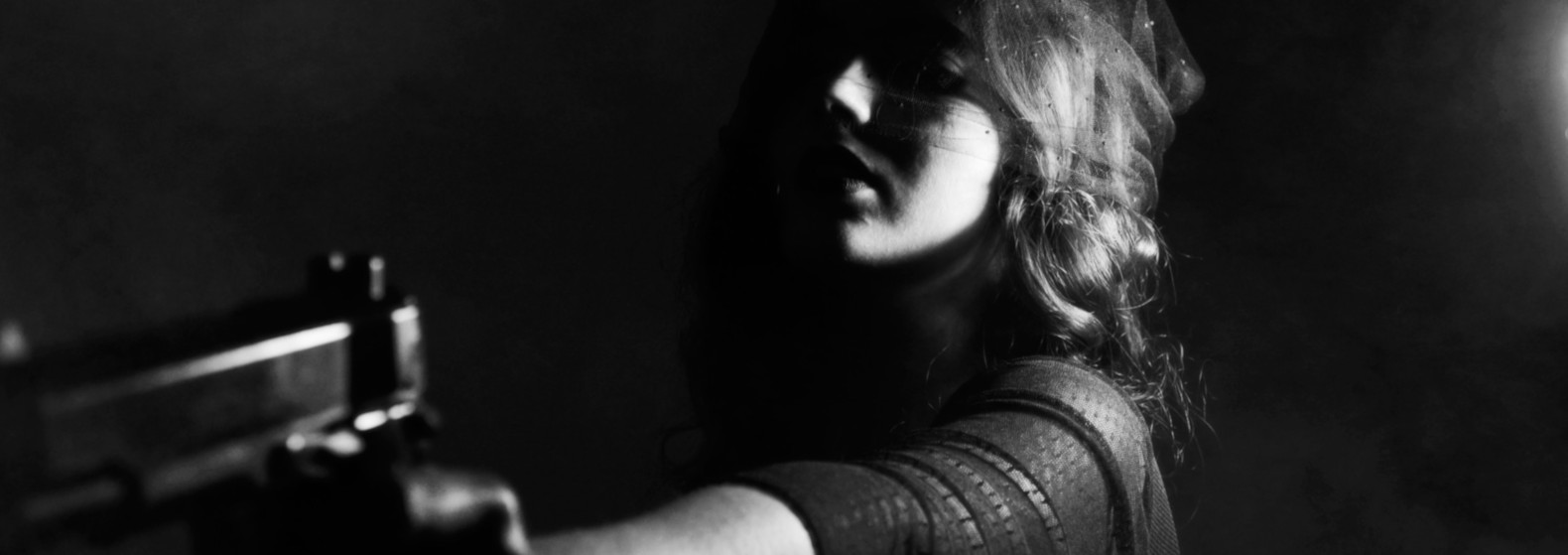 Silhouette of a woman holding a gun in a mystery-themed setting.