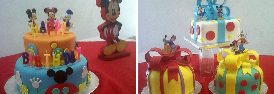 Two vibrant Mickey Mouse themed birthday cakes