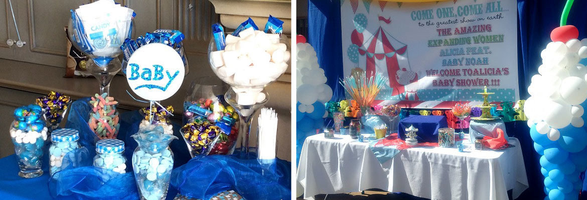 A dessert table with colorful candies and decorations for a baby shower.