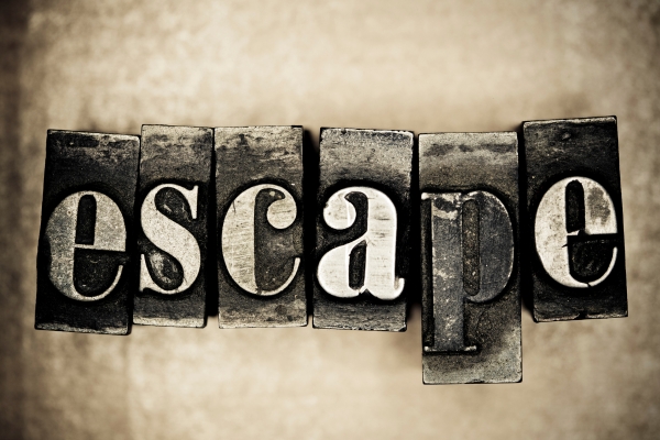 Wooden letters spelling 'escape' in vintage style