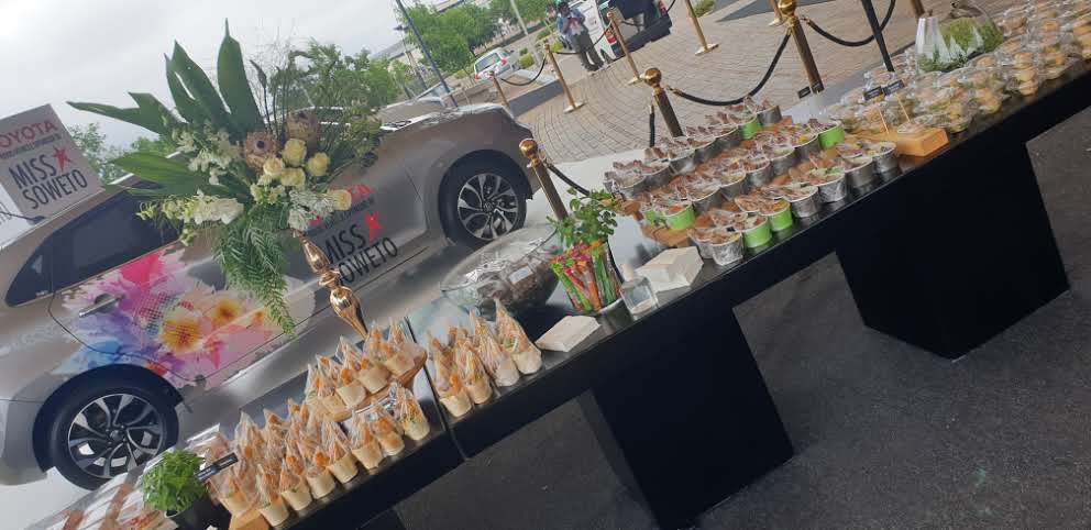 Elegant table with gourmet canapés and a floral arrangement