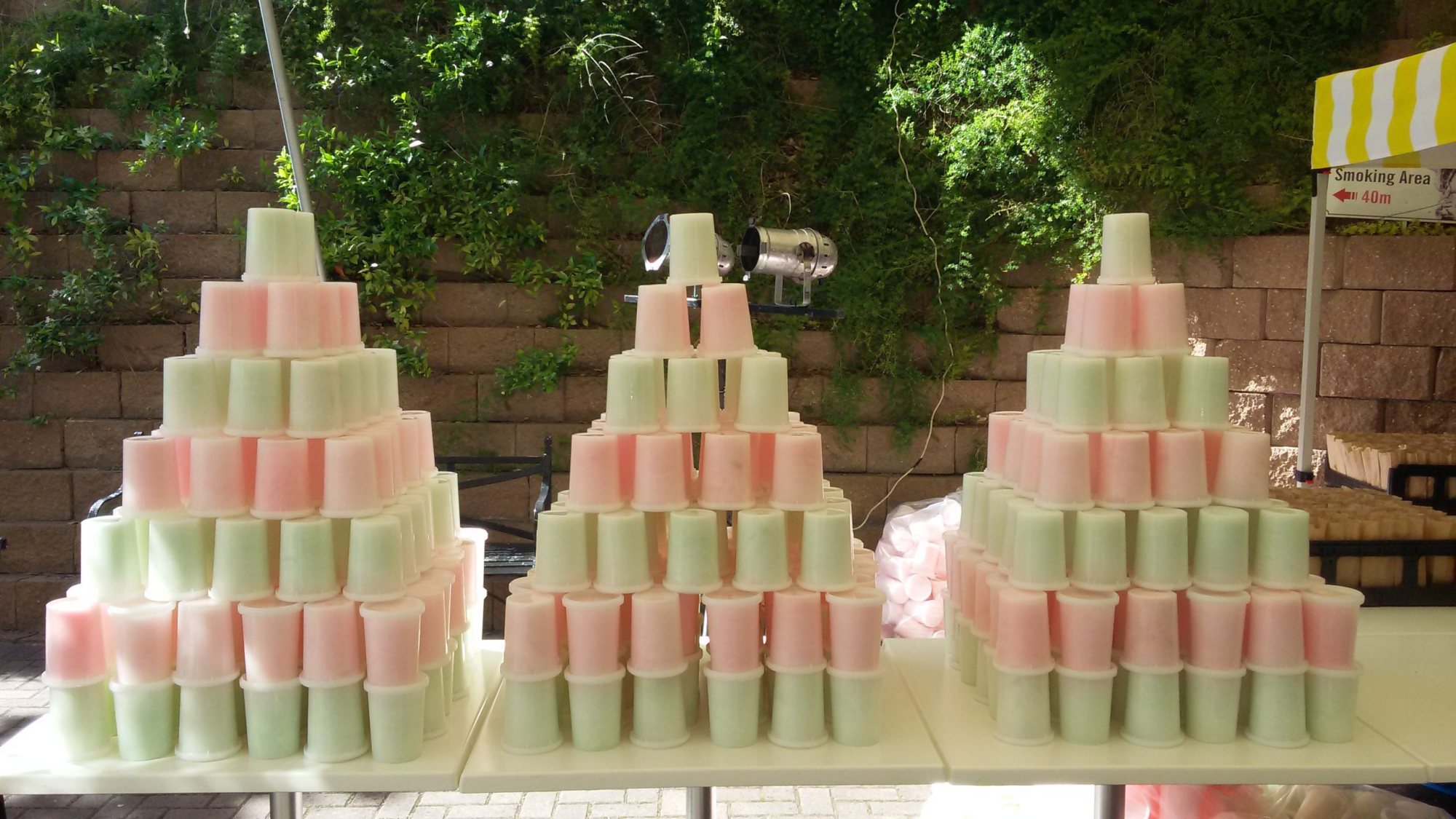Pyramids of pastel-colored candy floss cups on a table