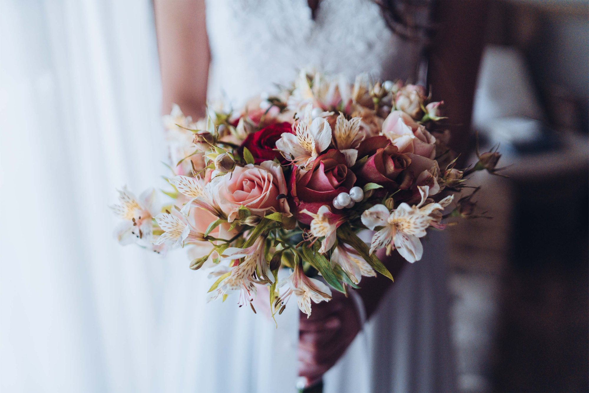 Bridal bouquet with pink roses and white flowers