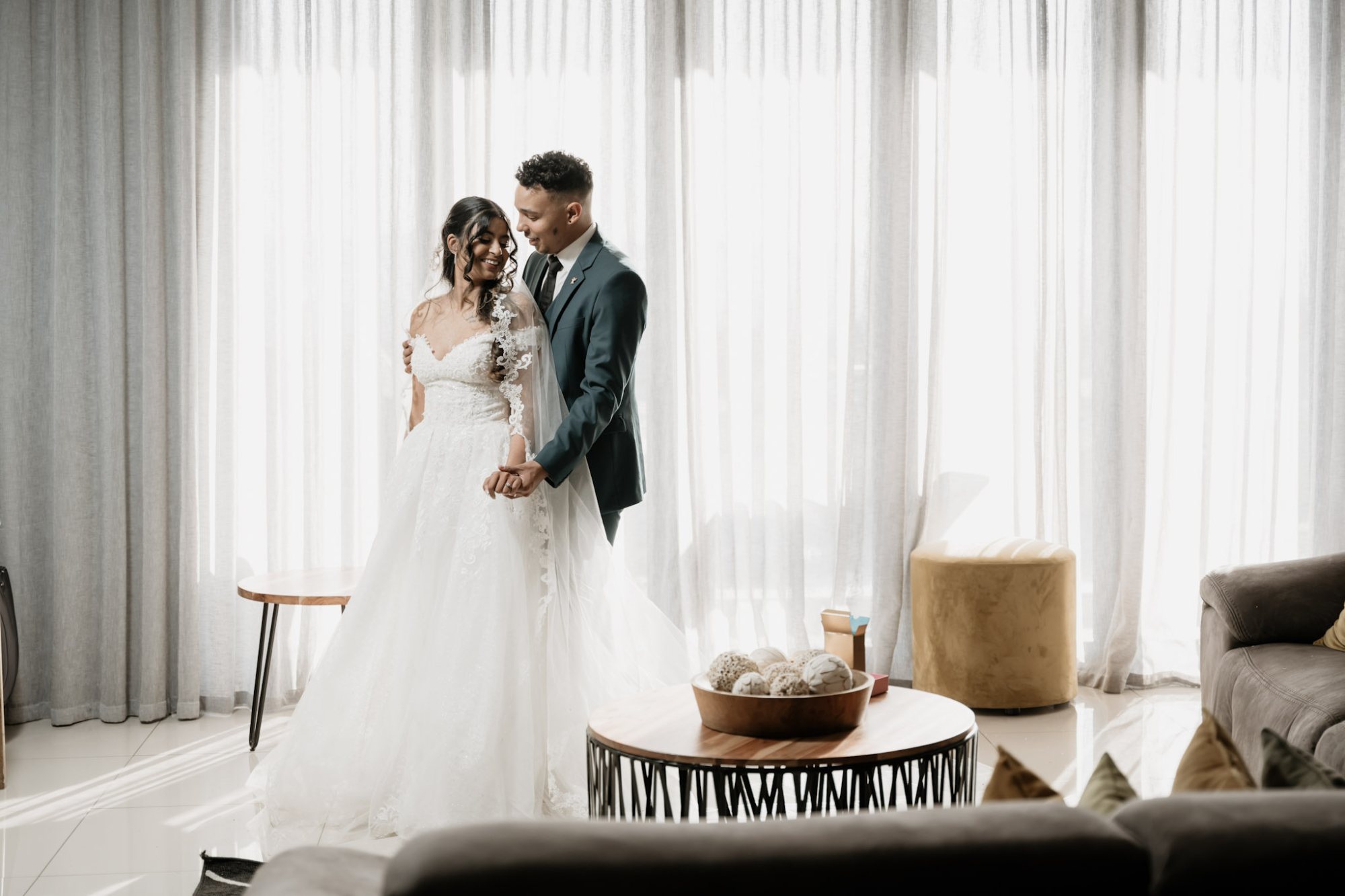 Bride and groom in a softly lit wedding venue