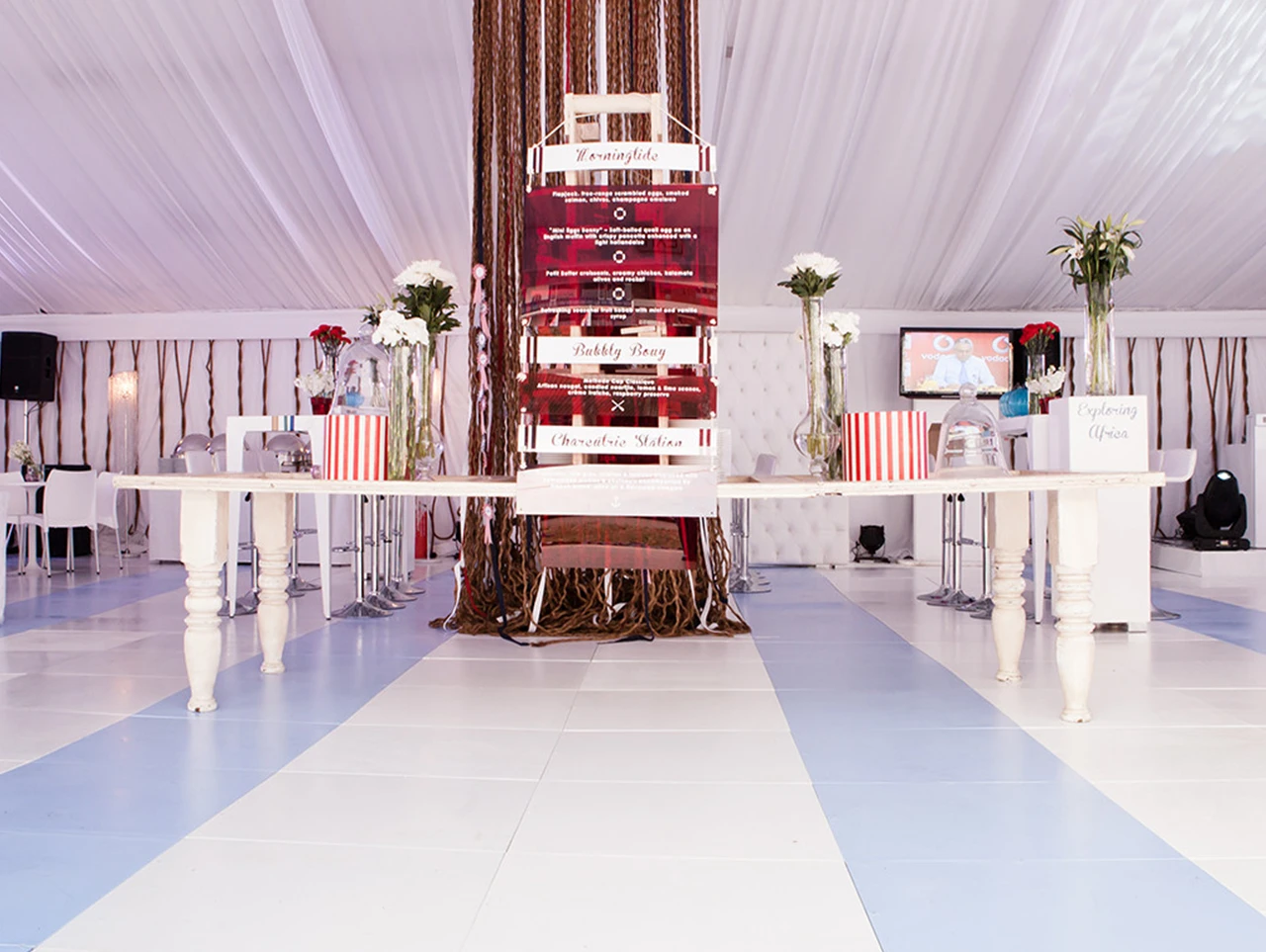 Modular white and blue flooring setup at an event