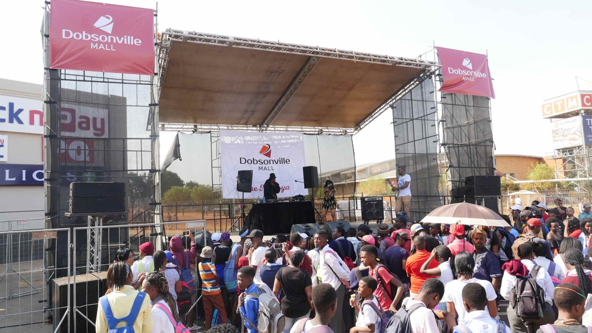 Outdoor stage at Dobsonville Mall with crowd