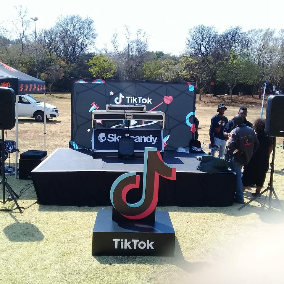 TikTok themed event setup with stage and branding