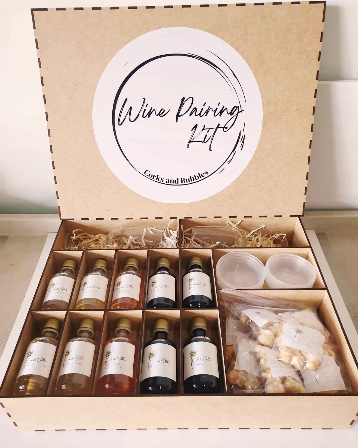 Wine Pairing Kit with bottles and snacks in a box