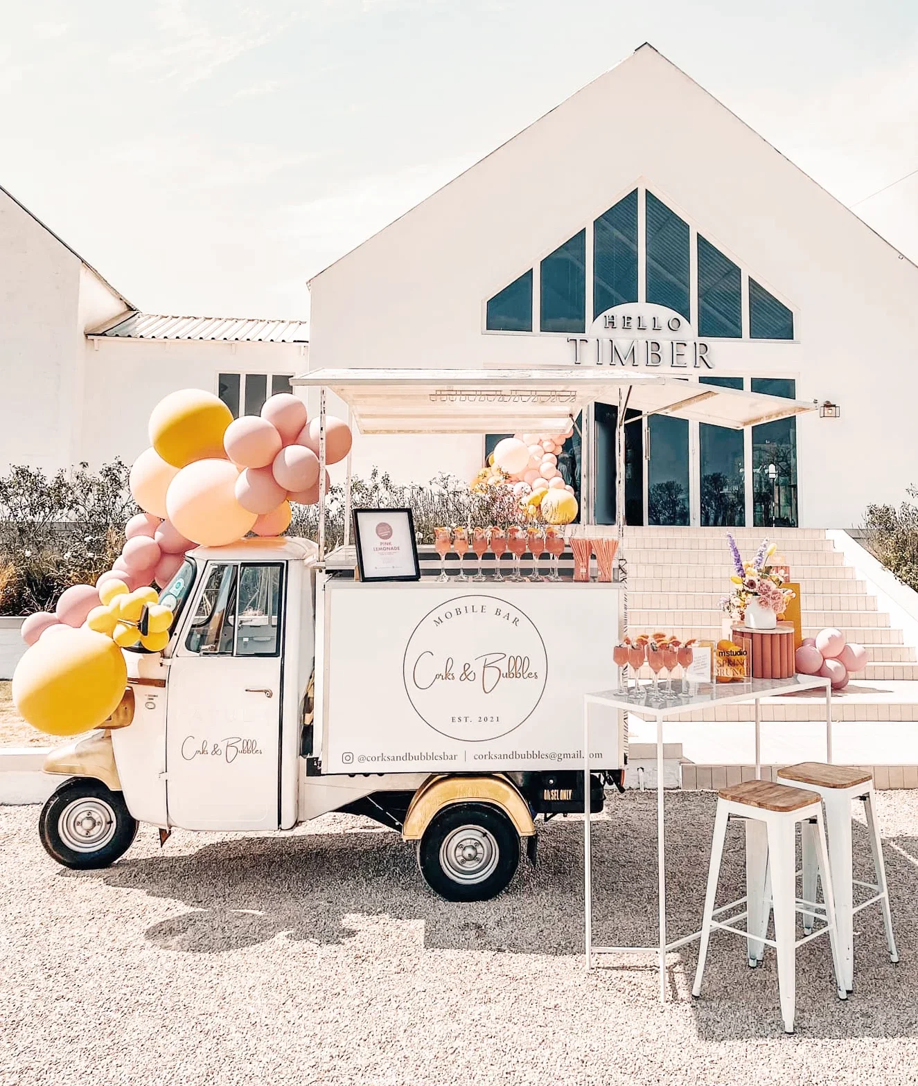 Mobile bar with balloons in front of a venue