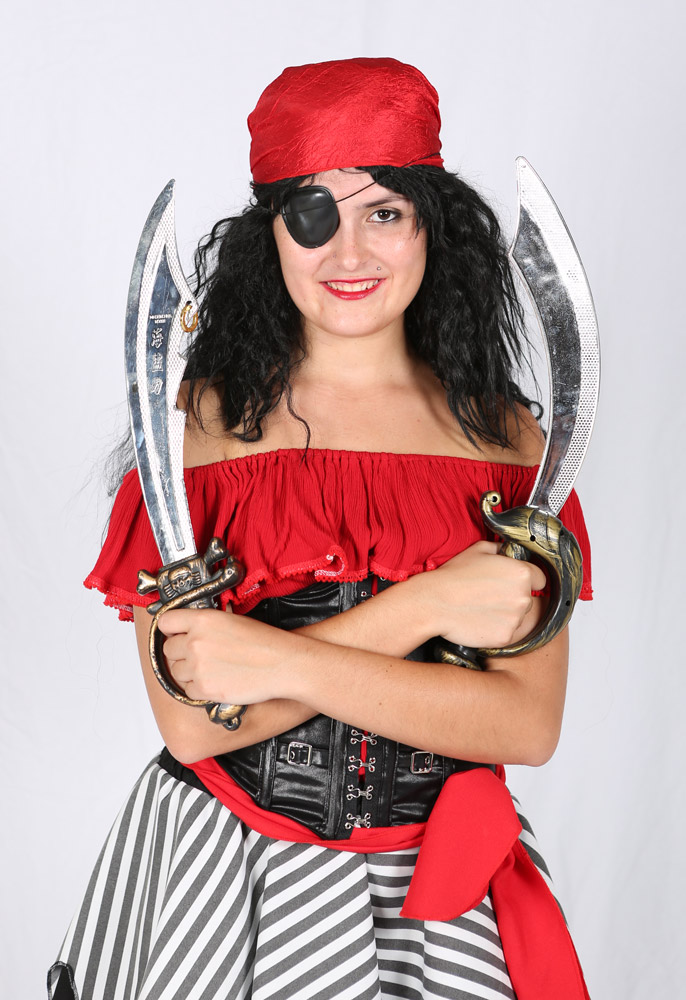 Model in pirate costume with swords, red bandana, and striped skirt.