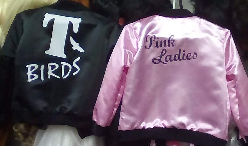 Black 'T BIRDS' and pink 'Pink Ladies' jackets