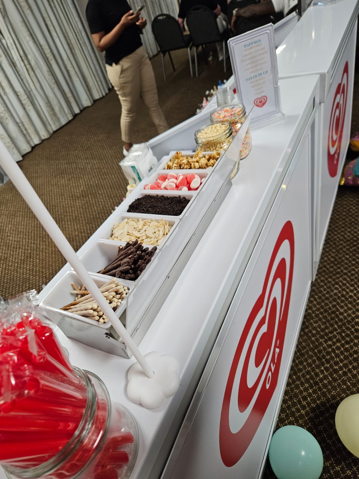 Mobile bubble tea bar with colorful toppings and snacks