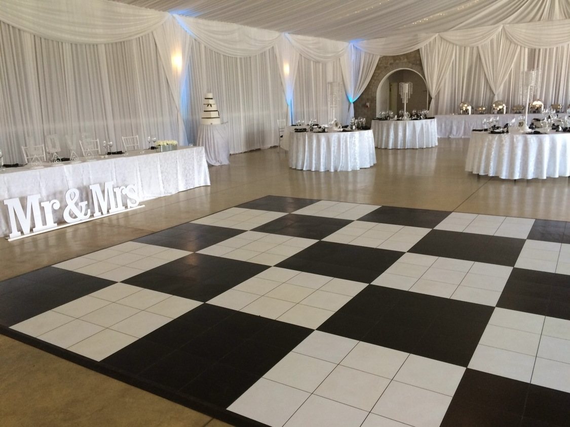 Black and white checkered dance floor with wedding decor